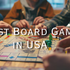 Best Board Games in USA featured on a tabletop scene with friends gathered around a Monopoly board, rolling dice and moving game pieces during a cozy game night indoors.