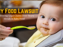 Baby eating from a spoon while the text reads “Baby Food Lawsuit: The Growing Legal Claims Over Heavy Metals in Baby Food,” highlighting concerns about heavy metals in baby food and related legal actions.