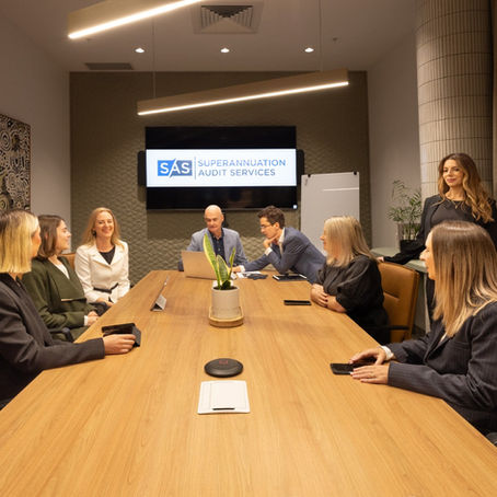 The Superannuation Audit Services team seated around a boardroom table