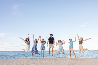 Family Photoshoot at The Cove Atlantis, Paradise Island Bahamas. Best Bahamas Photographer photographs fun family photo on bahamas beach.