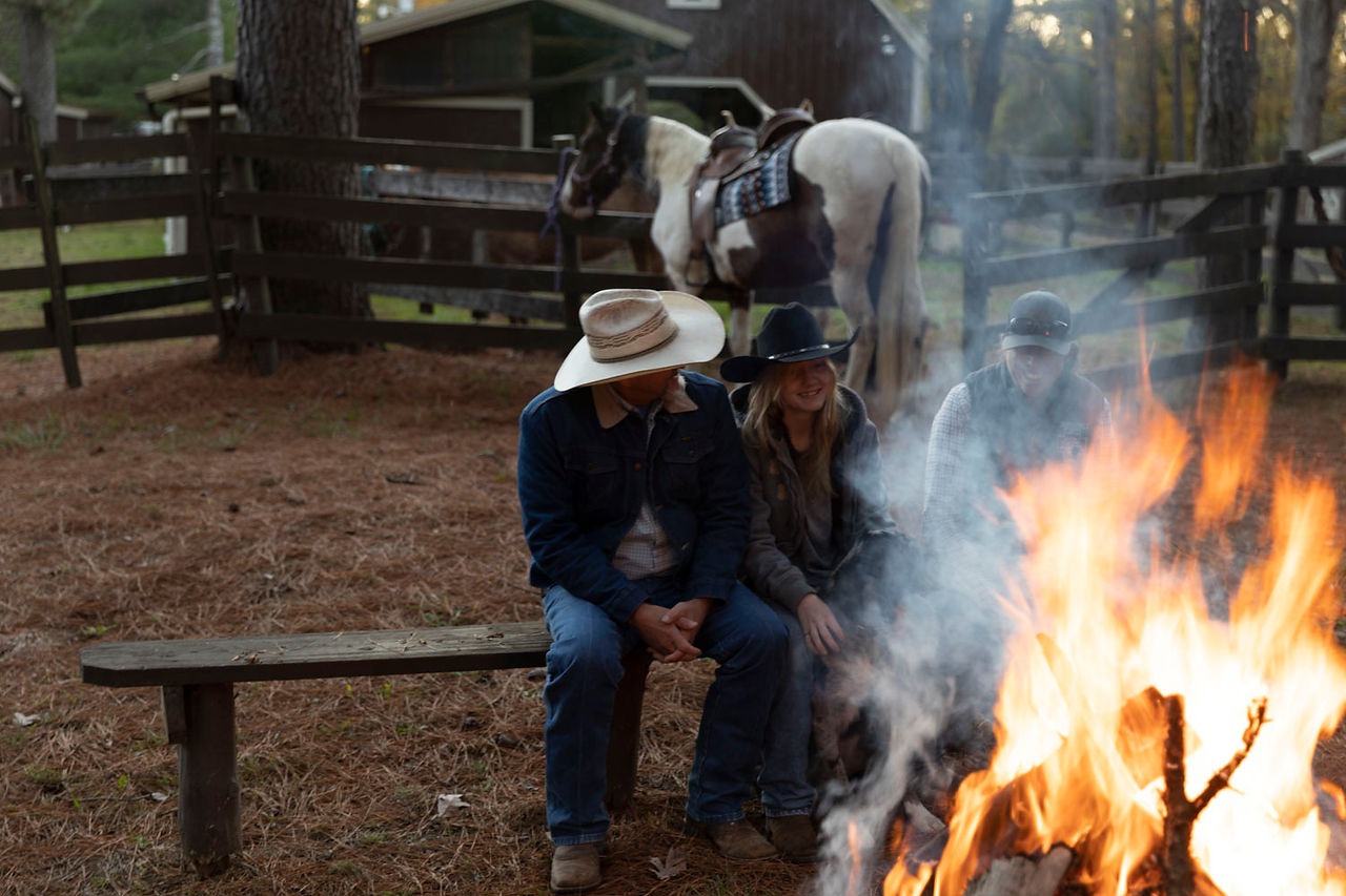 Jeff & Reagan Evans next to bonfire