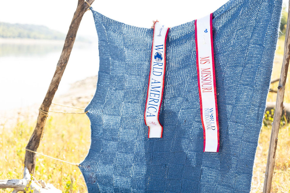Elizabeth's two ribbons. One is the Ms. World America, and one is Ms. Missouri