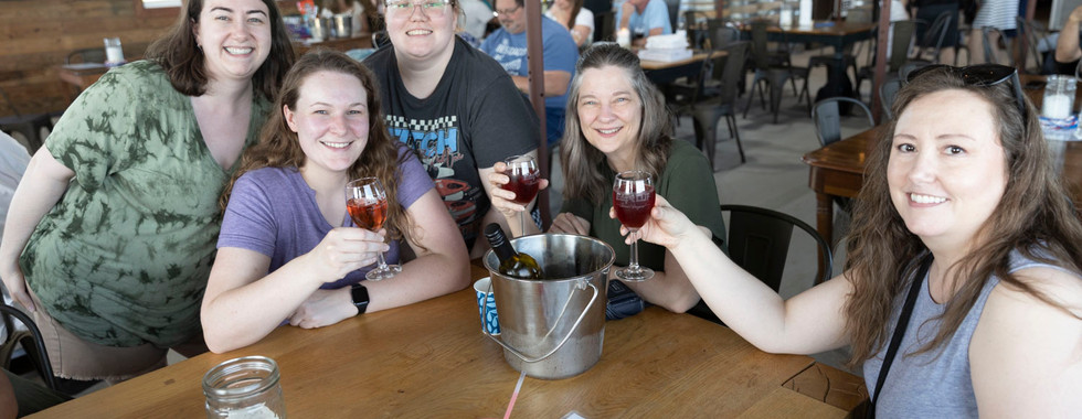 Edg Clif customers cheers in tasting room.