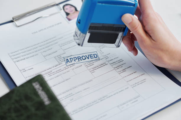 Applicant completing work visa form
