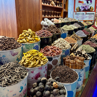 multi colored spices on display in canisters