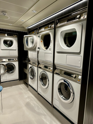 several silver washers and dryers