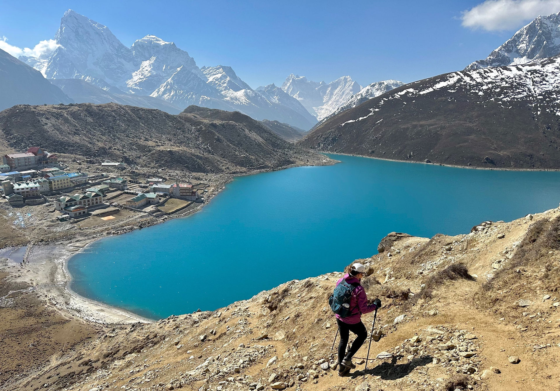 hiking past blue lake in Nepal
