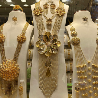gold necklaces on display