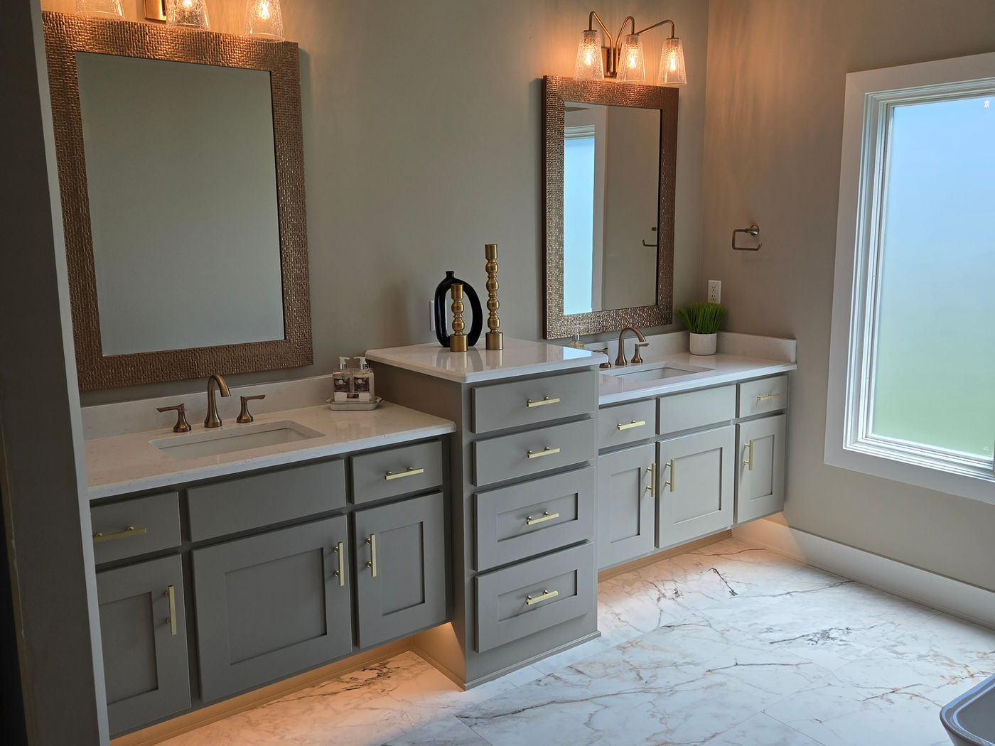 Bathroom remodel with a soaking tub and warm wood vanity