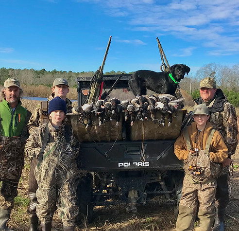 A group of people duck hunting