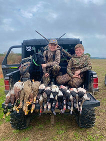 Kids with ducks representing duck hunti