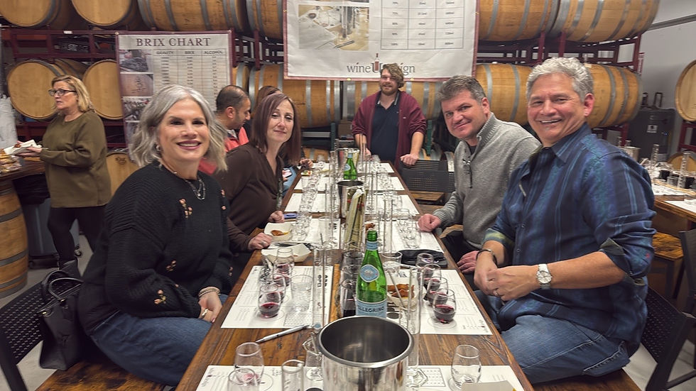A group at a wine blending table in the wineUdesign barrel room in Hicksville, Long Island