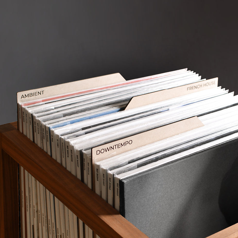 vinyl record dividers with laser-engraved custom titles separating records inside a minimal solid walnut record crate