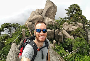 Justin Rowland, hiking a mountain in China