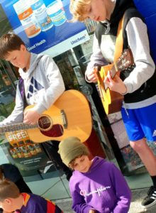 Young Wellington guitarists busking during school holiday program April 2019