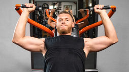 Shoulder workout machine in a gym setting, designed for targeted shoulder exercises—ideal for building strength using a shoulder exercise machine.