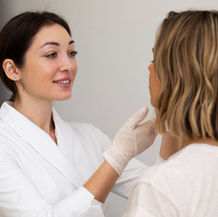 Medical professional performing a personalised skin consultation at a skin clinic in Thailand.