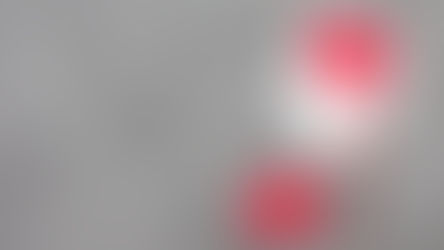 Paper silhouette of a human head showing a red brain and heart connected by a ribbon, symbolizing emotional awareness, on a gray textured background.