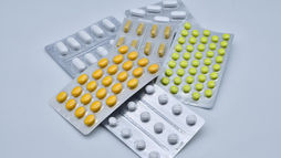 Selection of vitamin and mineral supplements arranged on a table
