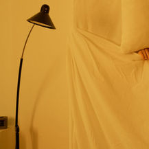 Woman lying awake at night while considering acupuncture for sleep