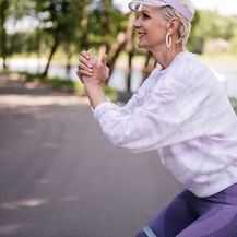 Senior woman exercising with a resistance band to support joint strength and mobility