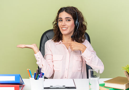 smiling-pretty-caucasian-female-call-center-operator-headphones-sitting-desk-with-office-t