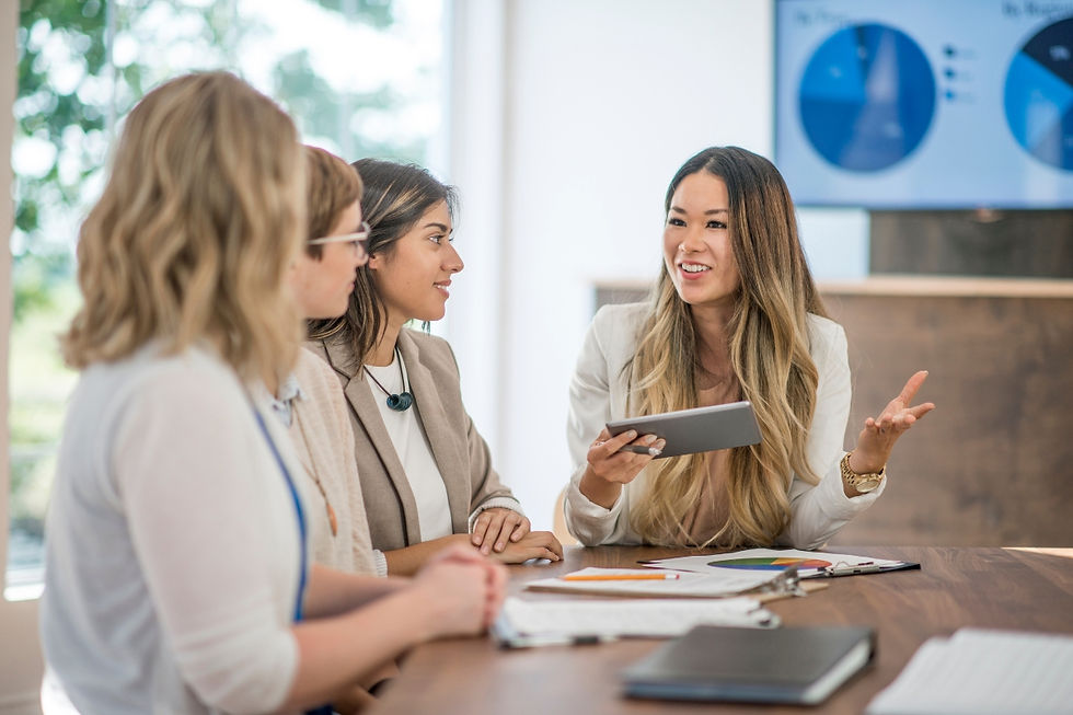 A group of travel agent sitting at a conference table