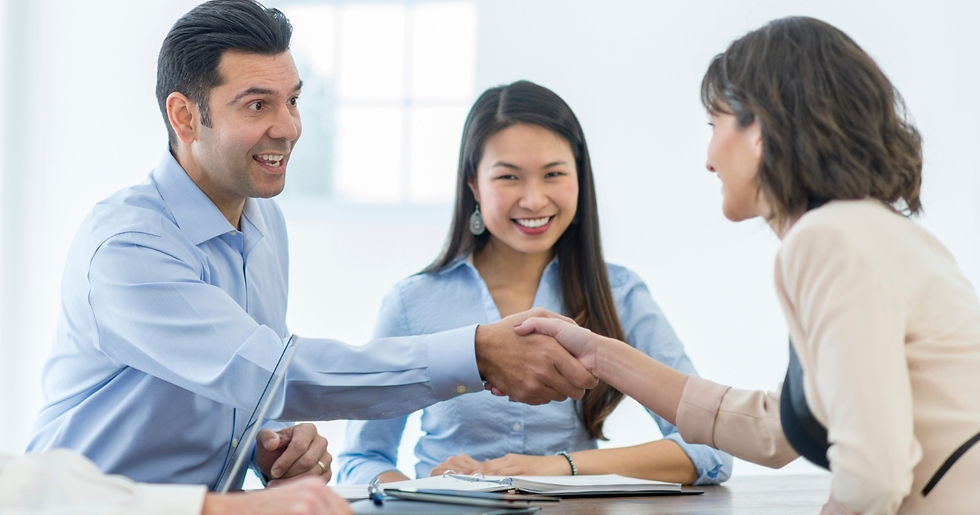 A group of business people shaking hands at a meeting