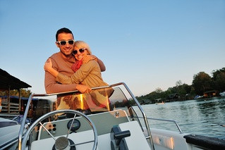 happy young couple in love have romantic time at summer sunset at ship boat while representing urban and countryside fashin lifestyle