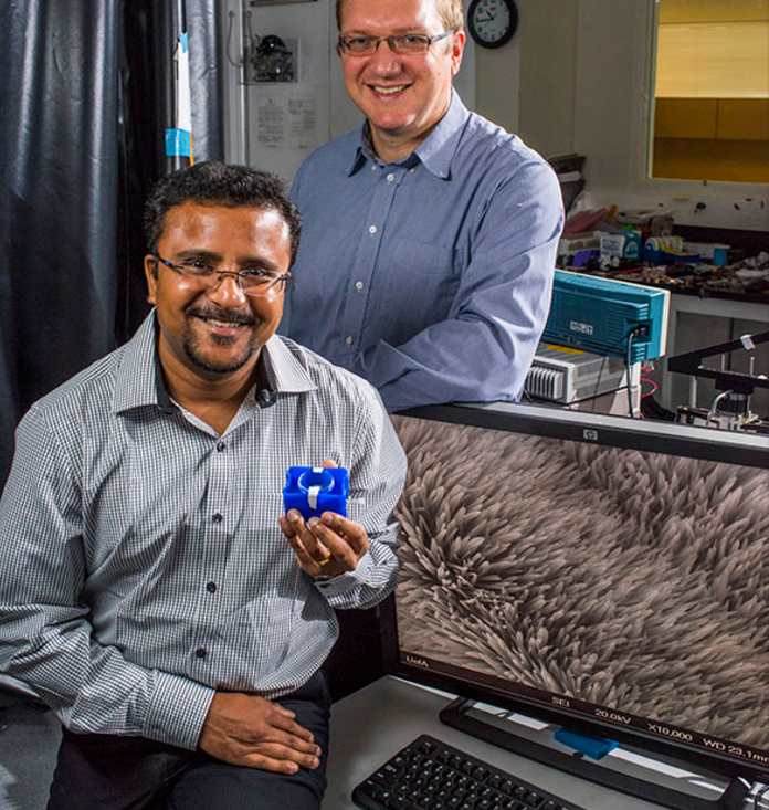 Vakhtang Putkaradze and Arindam Phani (seated), along with Thomas Thundat, have created a resonator with nanoscale features to detect dangerous chemicals in the environment.