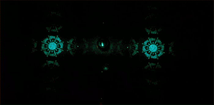 Holograms projected on a white screen while changing the wavelength of light from blue to red. (Image courtesy of the Capasso Lab)