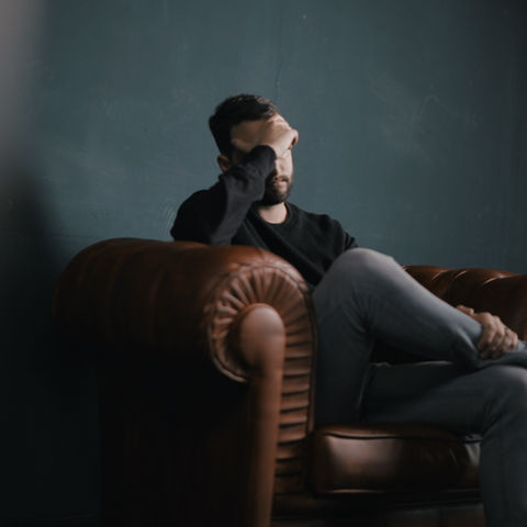 Thinking Man on Couch