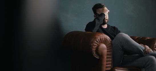 Thinking Man on Couch