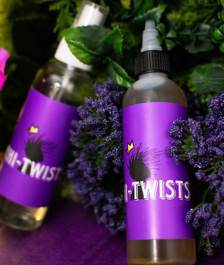 Loc Products nestled in purple background with flowers