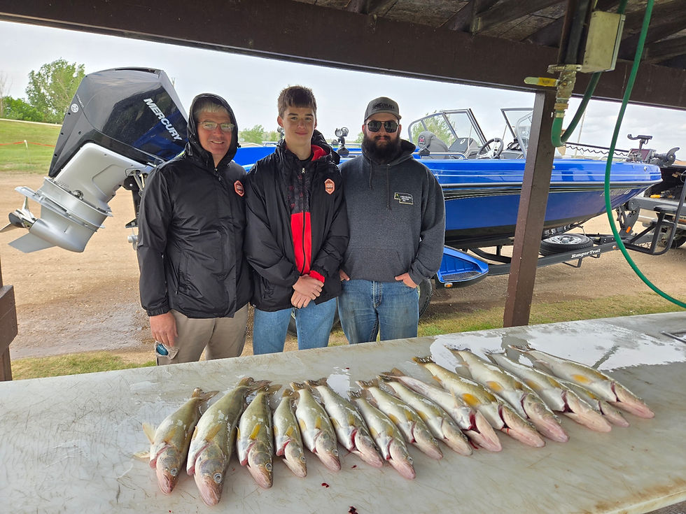 Three happy anglers proudly display their catch of the day, showcasing a successful fishing trip beside a boat and a table full of fresh fish.