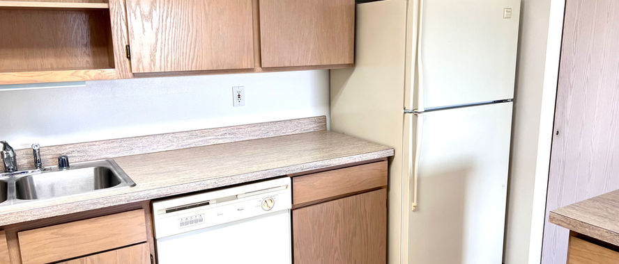 kitchen and refrigerator in independent living condo