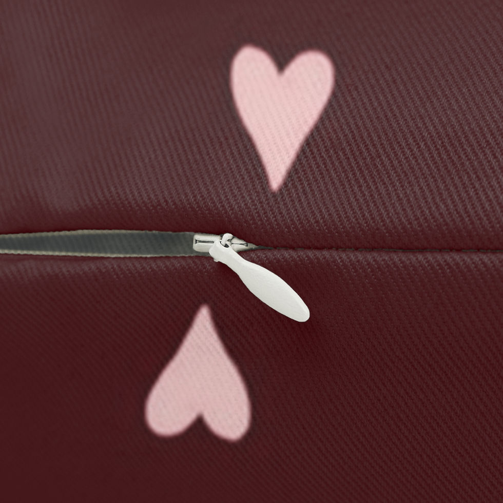 Thumbnail: A soft, supportive lumbar pillow hand-finished with a warm, hand-drawn heart pattern on deep burgundy.