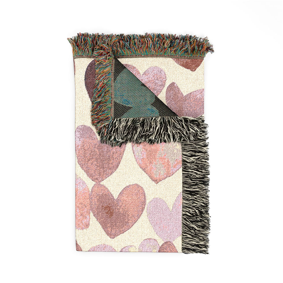 Thumbnail: A handwoven cotton blanket with soft, painterly heart motifs and colorful fringed edges.