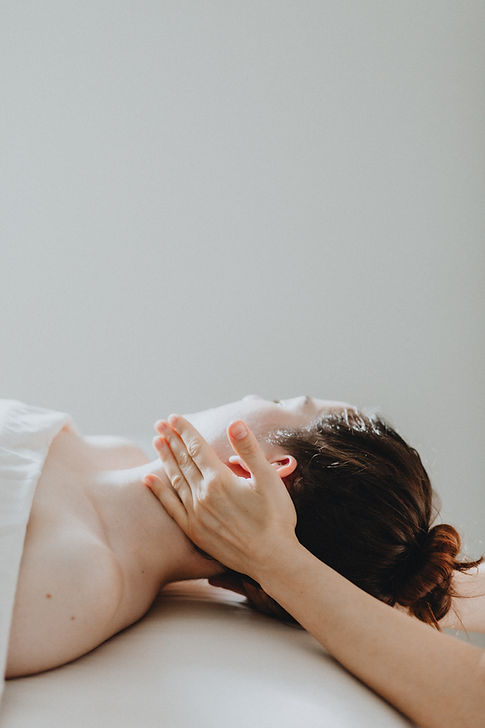 Massage therapist treating whiplash injury in Portland clinic