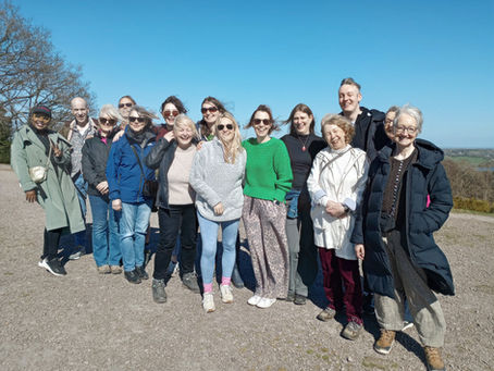 A group of participants of Enneagram Training UK & Ireland, learning together in community in the outdoors.