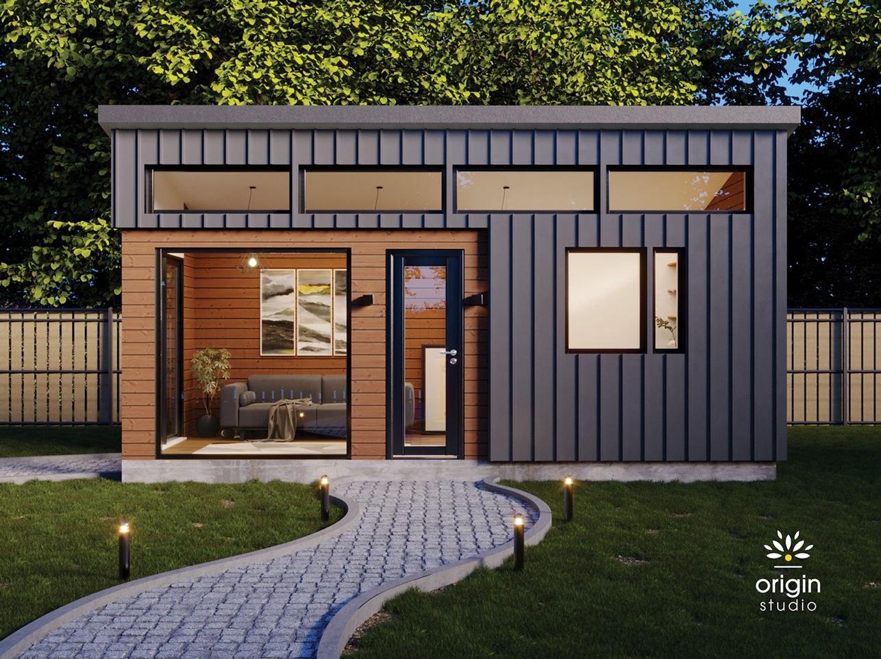 Pre-fab ADU exterior view with grey wall and a stone path leading to large glass door