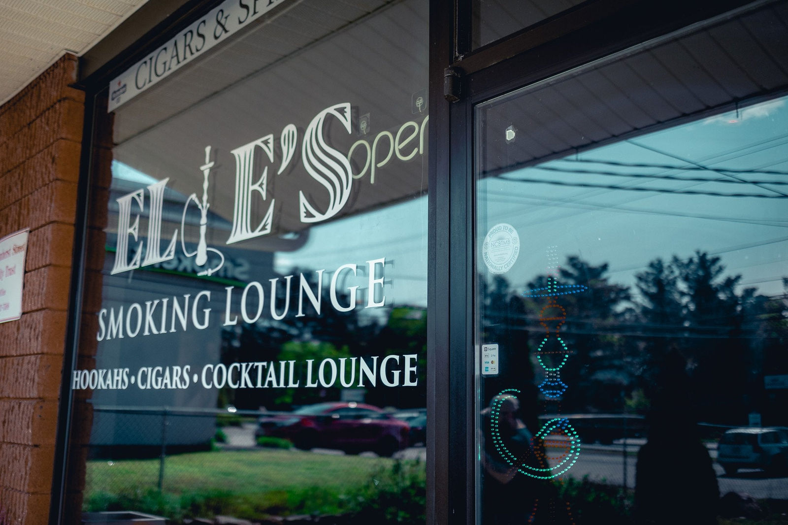 Window graphics on a cigar lounge storefront