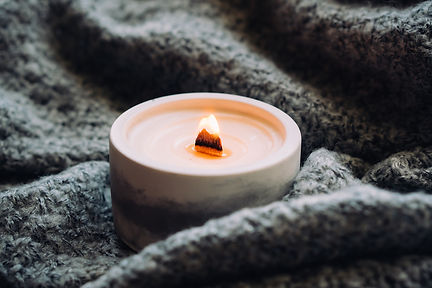 burning wooden wick candle