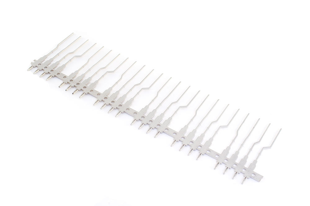 This lead frame for an automotive radar module features our approved 0.64mm thick press-fit terminal, and is stamped (and subsequently insert molded) in-house.