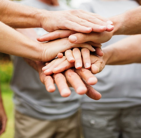 Team hands stacked together, linking to the GrowthArc journey of assess, plan and manage for aged-care support
