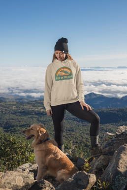 mockup-of-a-female-hiker-standing-at-the-top-of-a-mountain-with-her-dog-30496.png