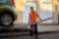 male-road-worker-uniform-preparing-tow-truck-platform-car-loading-city-street-side.jpg