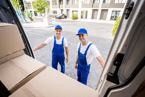 two-removal-company-workers-unloading-boxes-from-minibus.jpg