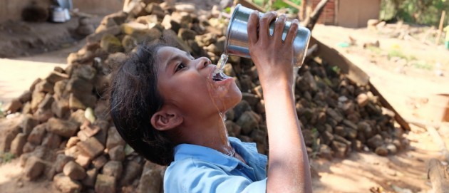 Little girl drinks safe water
