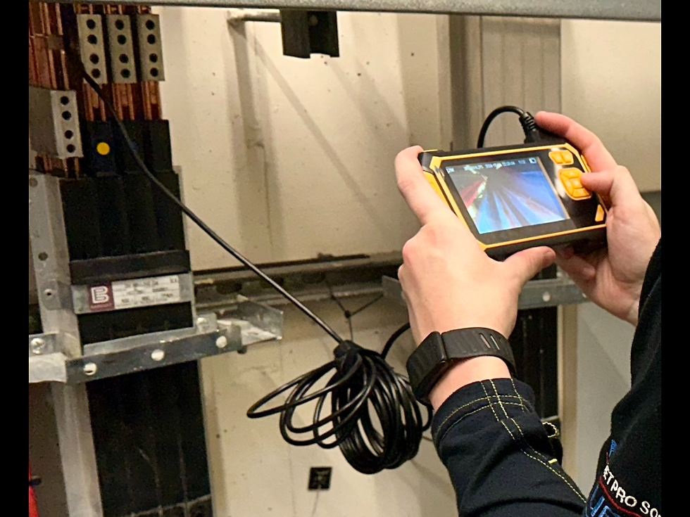 Close-up view of copper busbar connections in an electrical panel